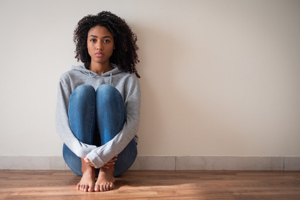 Teenager sitting alone